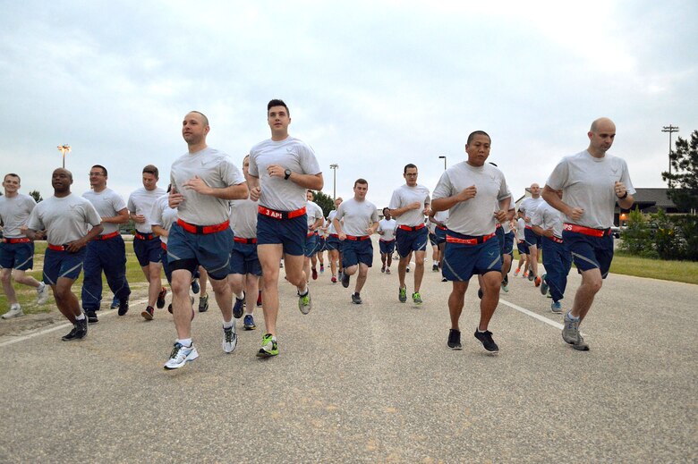 Pope Field Airmen including members from the 3rd Aerial Port Squadron participate in a memorial ‘Port Dawg’ 5K run around the Pope Field flightline May 13 honoring seven fallen air transportation Airmen who lost their lives in 2014. (U.S. Air Force photo/Marvin Krause)