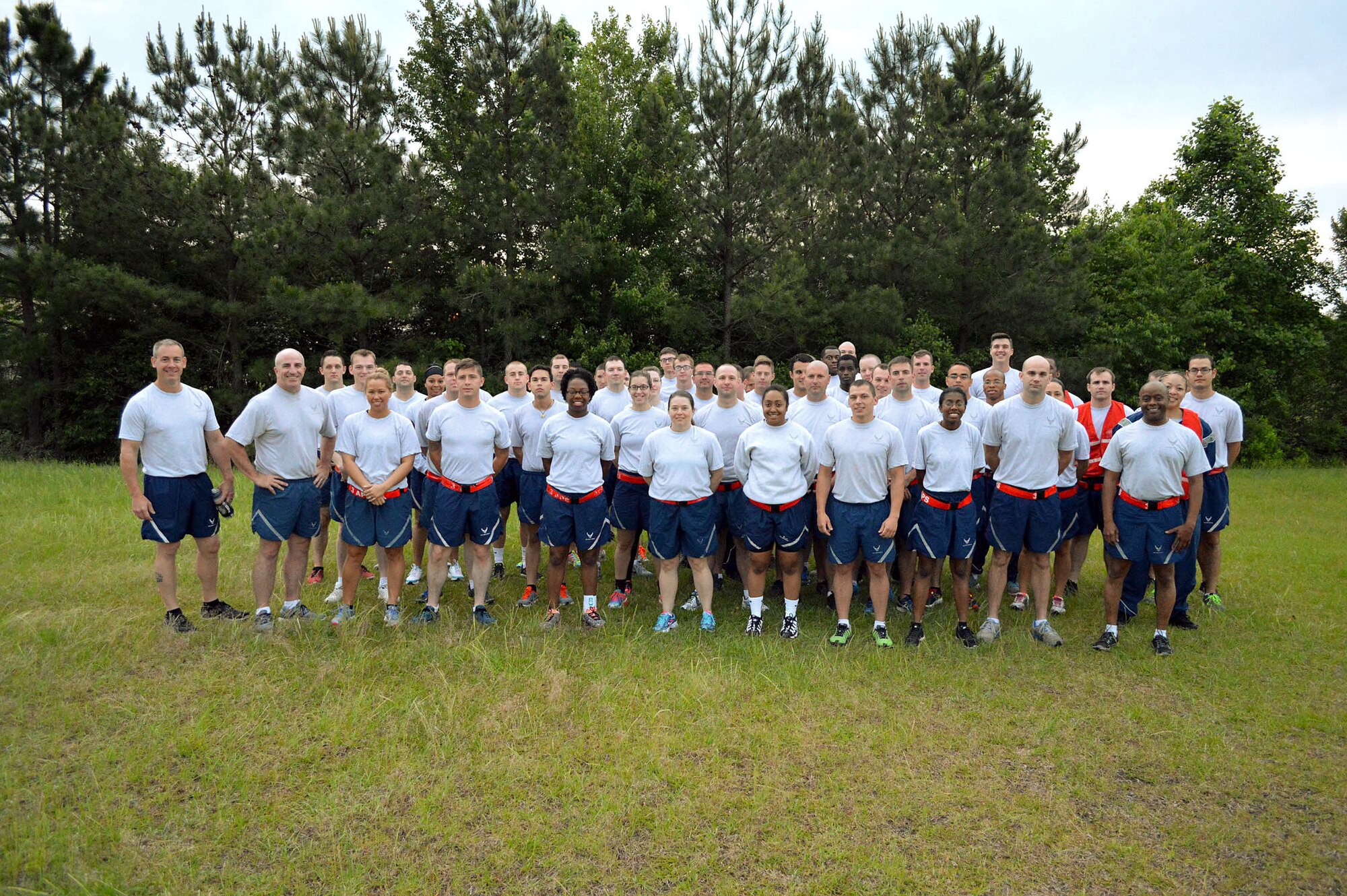 Pope Field Airmen including members from the 3rd Aerial Port Squadron pose for a group photo prior to participating in a memorial ‘Port Dawg’ 5K run around the Pope Field flightline May 13 honoring seven fallen air transportation Airmen who lost their lives in 2014. (U.S. Air Force photo/Marvin Krause)