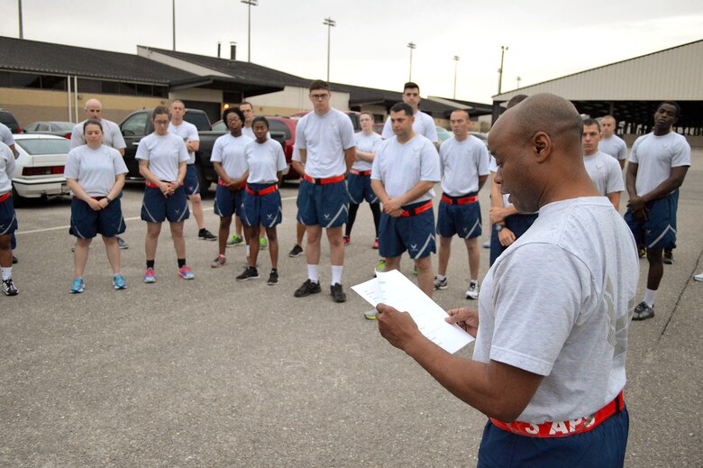 Chief Master Sgt. Kenneth Hubbard, 3rd Aerial Port Squadron superintendent, reads aloud the names of seven fallen air transportation Airmen who lost their lives in 2014 prior to a memorial ‘Port Dawg’ 5K run around the Pope Field flightline May 13. (U.S. Air Force photo/Marvin Krause)