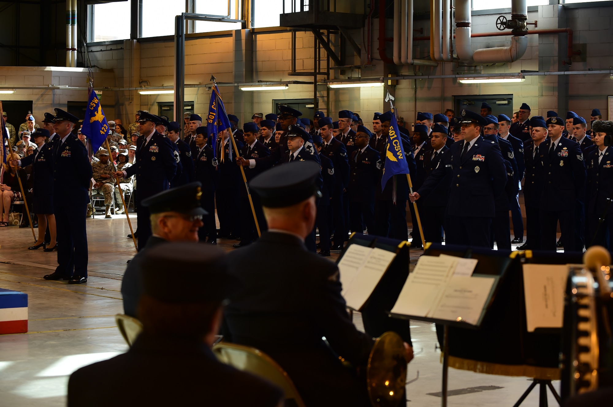 Airmen from the 501st Combat Support Wing stand in attendance during the wing change of command ceremony at RAF Alconbury, England, May 28, 2015. The ceremony introduced Col. Kevin Cullen as the newest commander of the nation's only combat support wing. (U.S. Air Force photo by Tech. Sgt. Chrissy Best/Released)