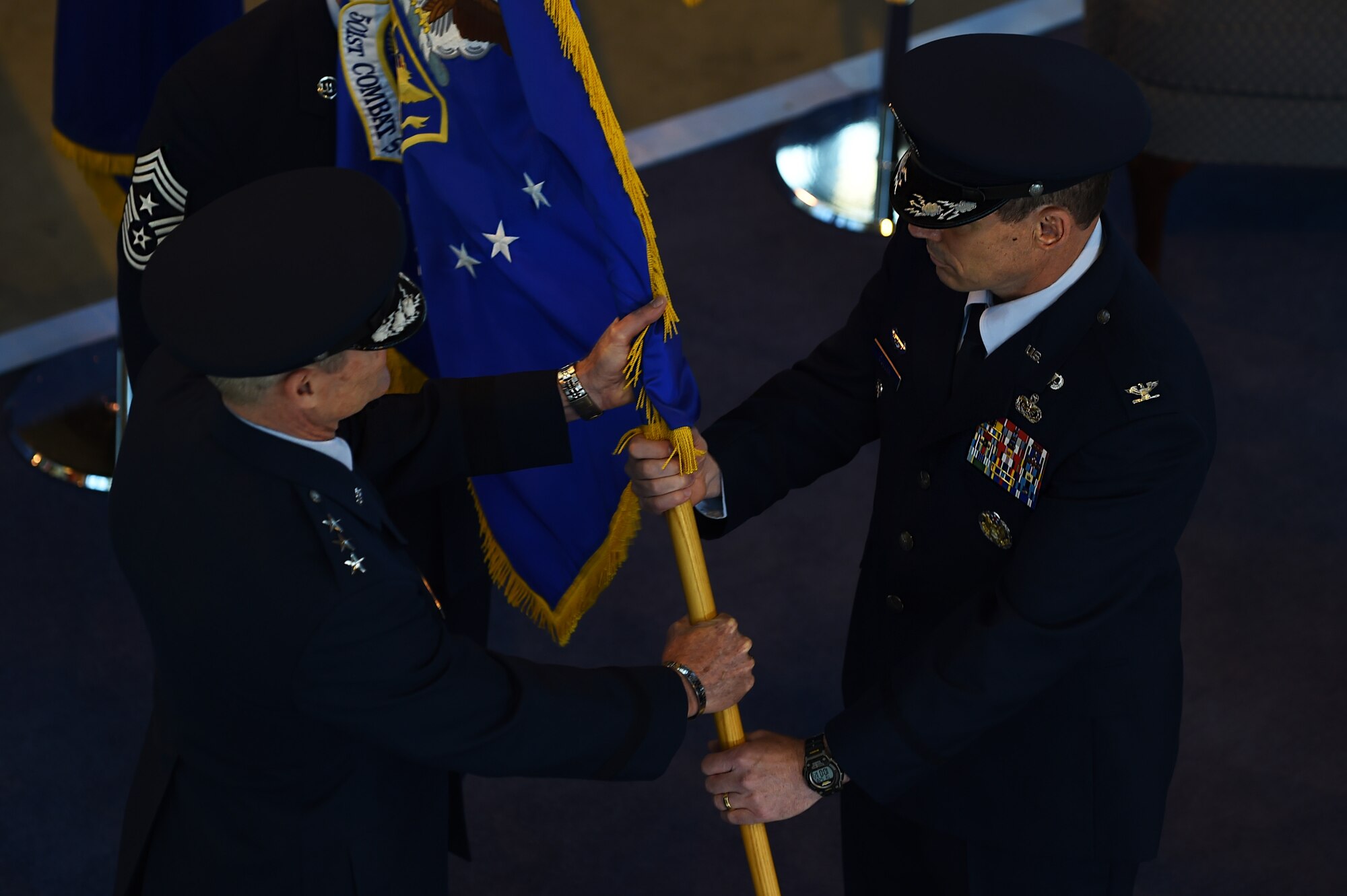 U.S. Air Force Lt. Gen. Darryl Roberson, 3rd Air Force and 17th Expeditionary Air Force commander, left, passes command of the 501st Combat Support Wing to Col. Kevin Cullen during a ceremony at RAF Alconbury, England, May 28, 2015. After assuming command, Cullen challenged Airmen of the wing to remain steadfast as Pathfinders and continue to light the way into new and amazing territory. (U.S. Air Force photo by Staff Sgt. Jarad A. Denton/Released)