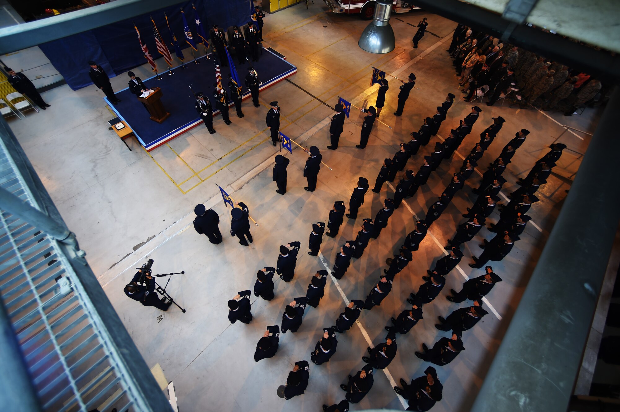 Airmen from the 501st Combat Support Wing render a salute as the colors are presented during the wing change of command ceremony at RAF Alconbury, England, May 28, 2015. After nearly two years as commander of seven installations, Col. Angela Cadwell relinquished command of the wing to Col. Kevin Cullen. (U.S. Air Force photo by Staff Sgt. Jarad A. Denton/Released)