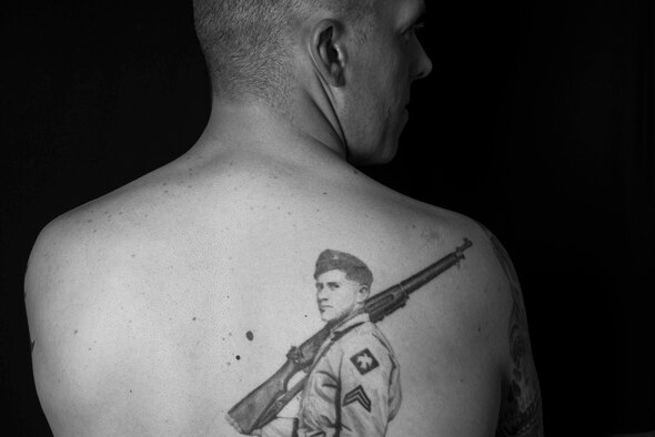 Master Sgt. Vernon Davenport has the tattoo of his late grandfather, J.D. Davenport, a World War II and Korean War veteran, to symbolize their close relationship during his childhood. Davenport was abused and neglected by his parents and spent the summers with his grandparents, who helped raise him before they passed. Davenport is the first sergeant of the 35th Communications Squadron. (U.S. Air Force photo by Staff Sgt. Derek VanHorn/Released)