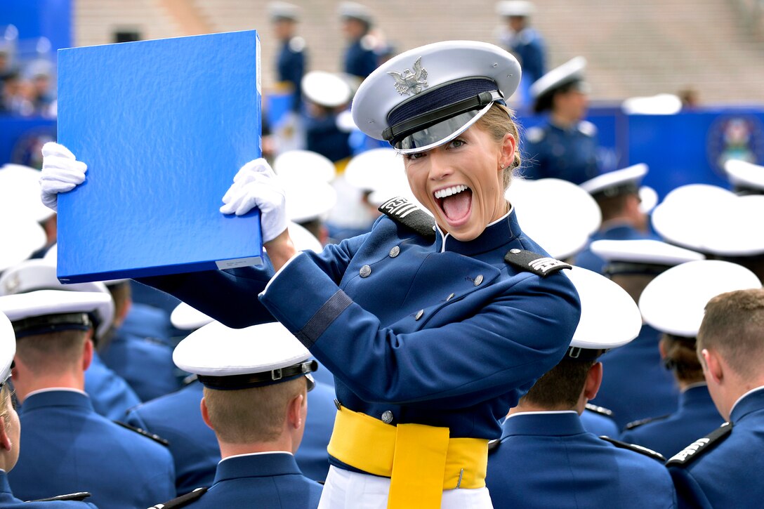 Cadet Kaitlin Butler waves her diploma during the U.S. Air Force Academy's Class of 2015 graduation ceremony at Falcon Stadium in Colorado Springs, Colo., May 28, 2015. 