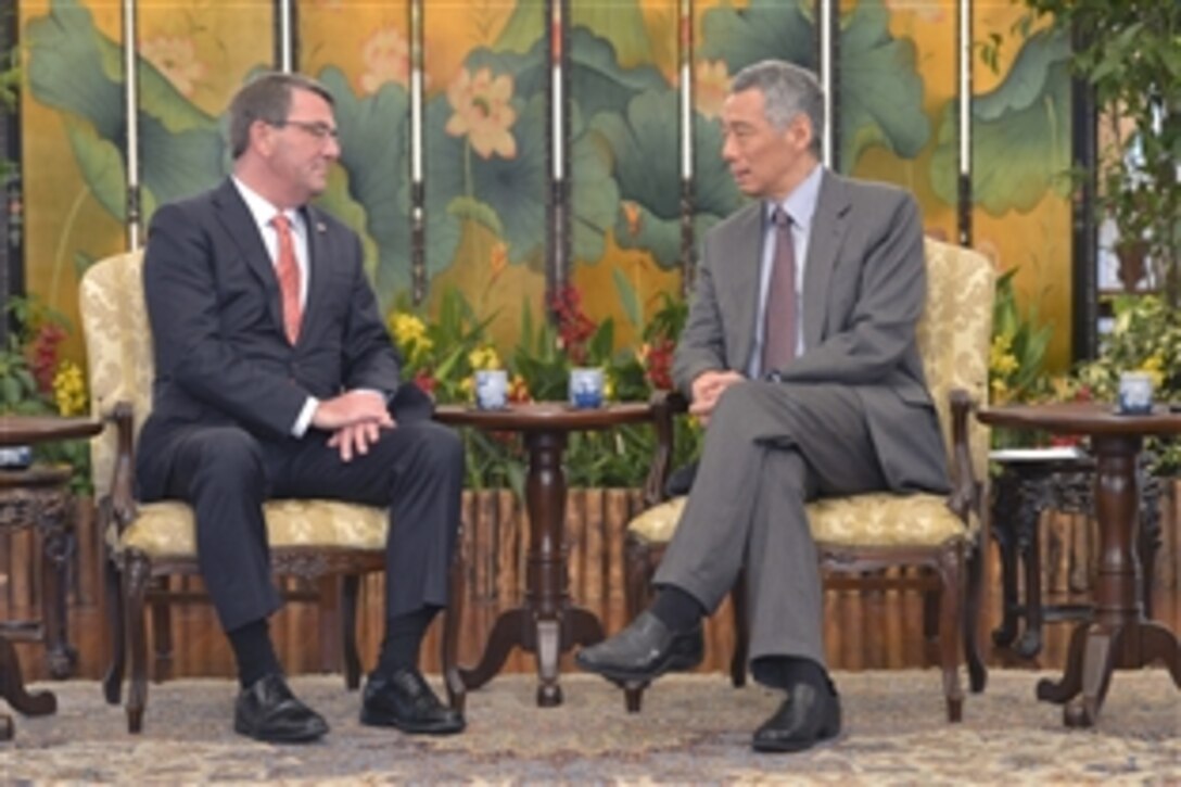U.S. Defense Secretary Ash Carter, left, meets with Singaporean Prime Minister Lee Hsien Loong in Singapore, May 29, 2015. Carter is visiting the Asia-Pacific region to strengthen relationships and modernize U.S. alliances.