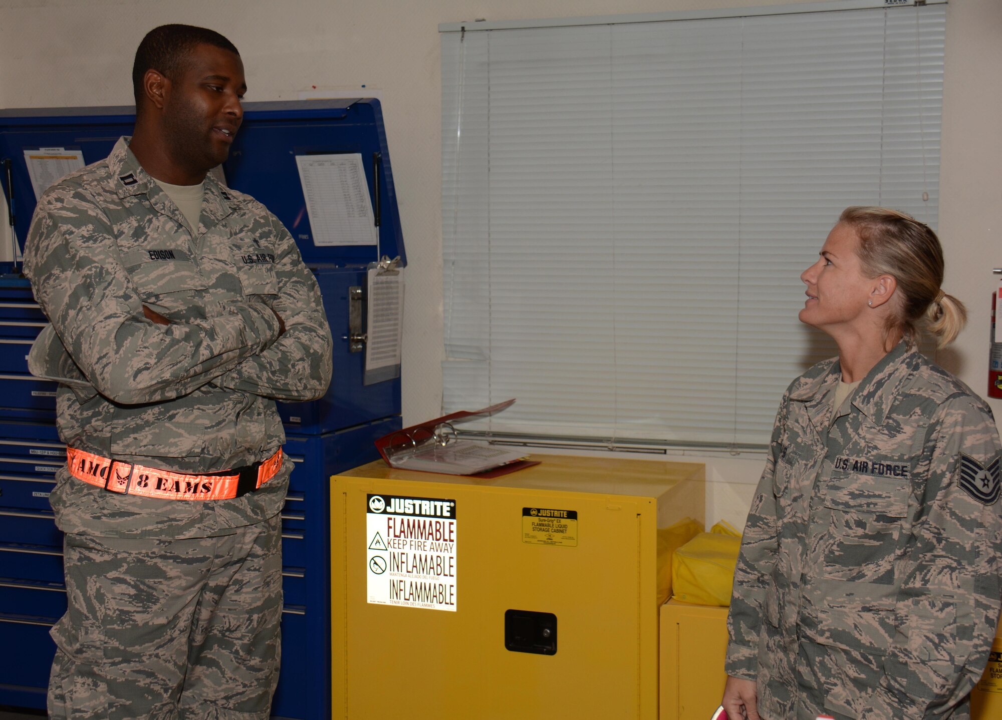 379th Air Expeditionary Wing Chaplain (Capt.) Karlton Edison (Left), meets with Tech. Sgt. Melissa Bayer (Right), 379th Expeditionary Operations Support Squadron aircrew flight equipment night shift supervisor, in her office at Al Udeid Air Base, Qatar Oct. 31 during a chaplain led Blitz Program visit. The program focuses on visiting shift workers and informing those airmen of the resources available to them. More than 20 professionals took part in the Halloween visit with 379th Expeditionary Operations Group airmen. (U.S. Air Force photo by Tech. Sgt. James Hodgman)