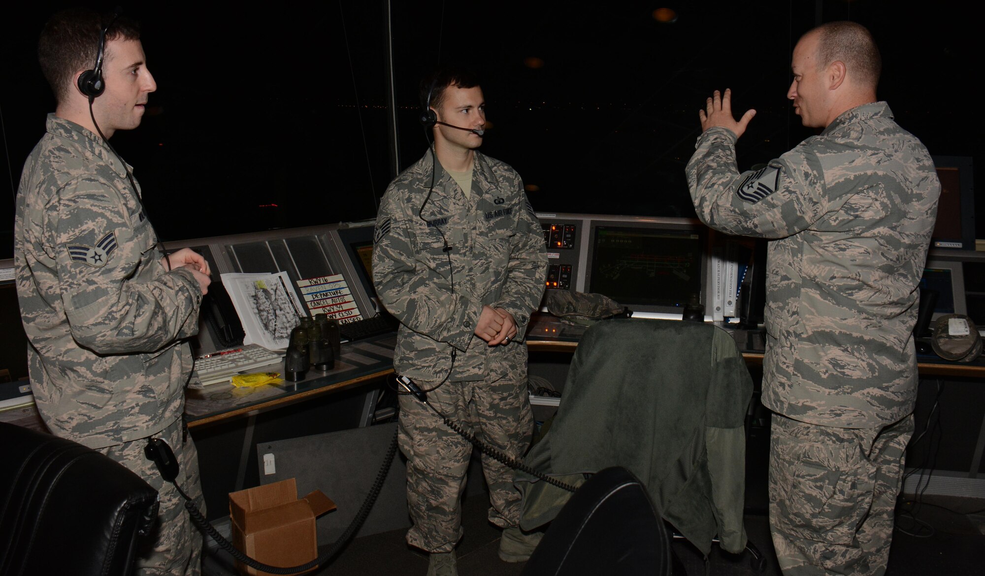 Master Sgt. James Smith (Right), 379th Air Expeditionary Wing superintendent of chaplain operations, meets with two 379th Expeditionary Operations Support Squadron air traffic controllers inside the tower at Al Udeid Air Base, Qatar Oct. 31 during a chaplain led Blitz Program visit. The program focuses on visiting shift workers and informing those airmen of the resources available to them. More than 20 professionals took part in the Halloween visit with 379th Expeditionary Operations Group airmen. (U.S. Air Force photo by Tech. Sgt. James Hodgman) 
