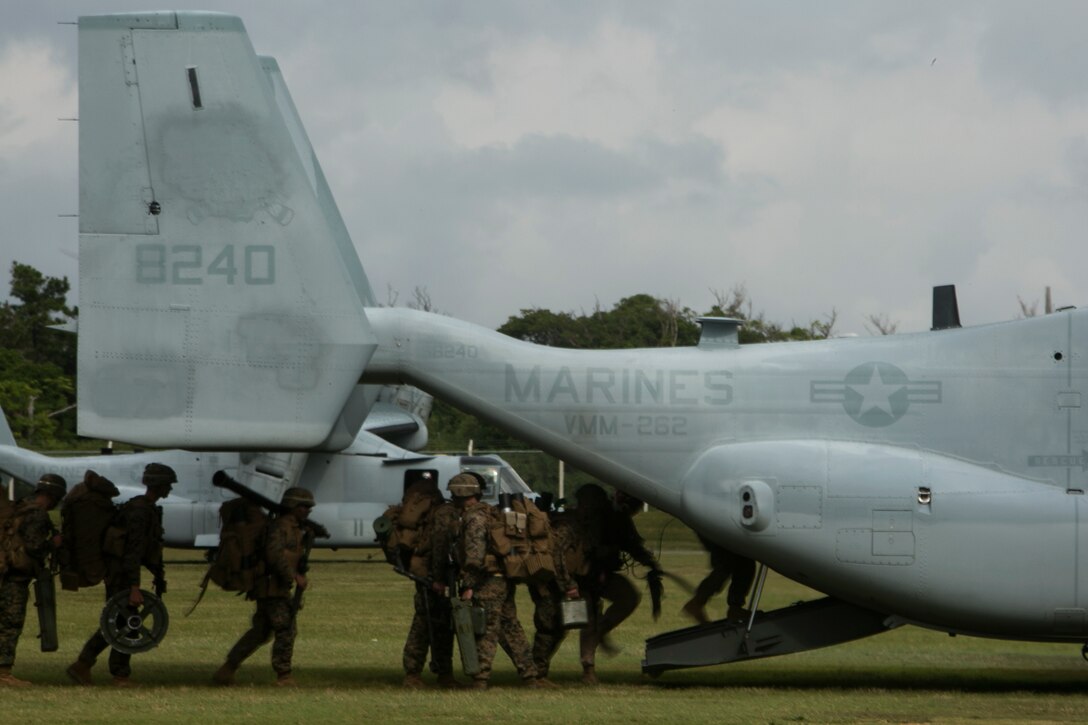 Marines board an MV-22B Osprey on Camp Hansen, Okinawa, Japan, to conduct a regimental air assault during Blue Chromite 2016, Oct. 31, 2015. Blue Chromite is a large-scale amphibious exercise that draws primarily from III Marine Expeditionary Force’s training resources on Okinawa. The location of the training allows participating units to maintain a forward-deployed posture and eliminates the cost of traveling to train. The Marines are with 1st Battalion, 2nd Marine Regiment, 2nd Marine Division, II MEF, currently under the command of 4th Marines, 3rd MarDiv, III MEF. The Ospreys are with Marine Medium Tiltrotor Squadron 262, Marine Aircraft Group 36, 1st Marine Airwing, III MEF. (U.S. Marine Corps photo by Cpl. Drew Tech/Released)