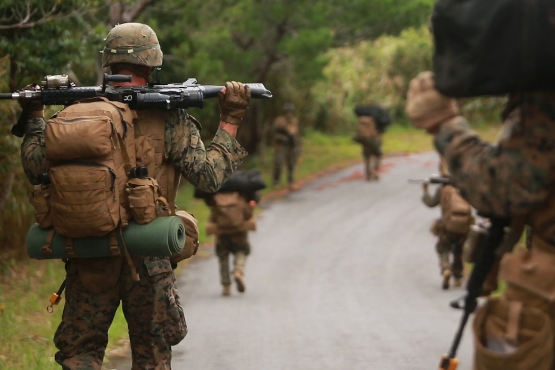 Marines patrol through the Jungle Warfare Training Center on Okinawa, Japan, as part of a regimental air assault during Blue Chromite 2016, Oct. 31, 2015. Blue Chromite is a large-scale amphibious exercise that draws primarily from III Marine Expeditionary Force’s training resources on Okinawa. The location of the training allows participating units to maintain a forward-deployed posture and eliminates the cost of traveling to train. The Marines are with 1st Battalion, 2nd Marine Regiment, 2nd Marine Division, II MEF, currently under the command of 4th Marines, 3rd MarDiv, III MEF. (U.S. Marine Corps photo by Cpl. Drew Tech/Released)