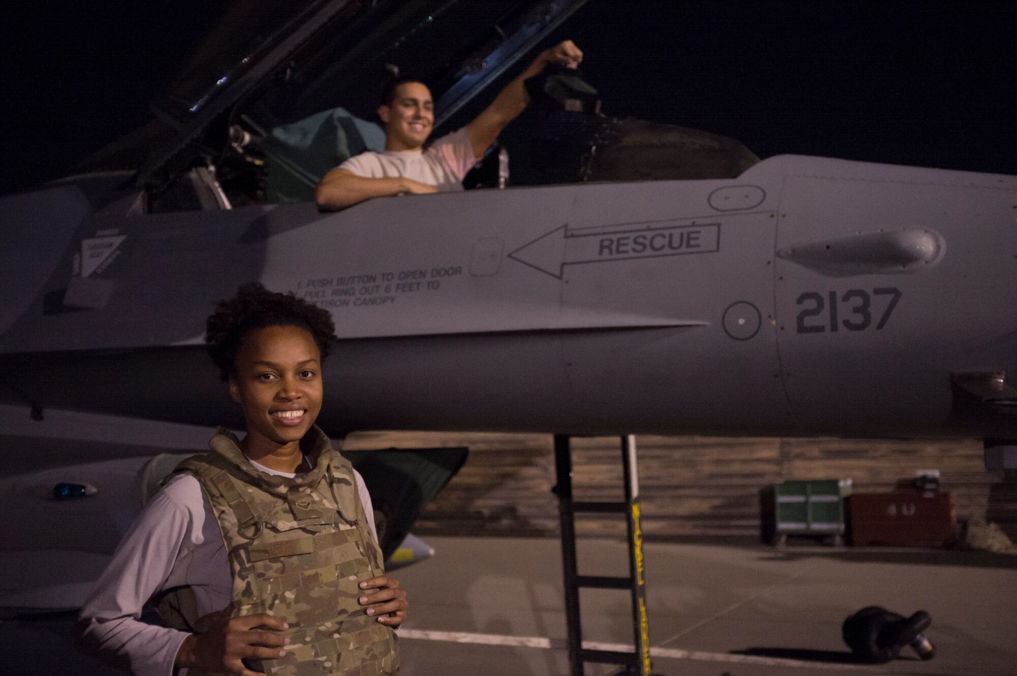 Airman 1st Class Trika Henry, left, and Senior Airman Julian Delfin, both Avionics System Specialists assigned to the 455th Expeditionary Aircraft Maintenance Squadron, prepare to troubleshoot the Identification Friend or Foe system on an F-16 Fighting Falcon aircraft at Bagram Airfield, Afghanistan, Sept. 23, 2015.  The F-16 is a multi-role fighter aircraft that is highly maneuverable and has proven itself in air-to-air and air-to-ground combat.  (U.S. Air Force photo by Master Sgt. Kevin Crawford/Released)