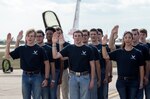 Air Force recruits recite the oath of enlistment at Joint Base San Antonio-Randolph Oct. 31, 2015. The enlistment was held before the U.S. Thunderbirds performance at the 2015 JBSA Air Show & Open House at JBSA-Randolph. In attendance were friends and family who witnessed the enlistment.(U.S. Air Force photo by photo by Johnny Saldivar)