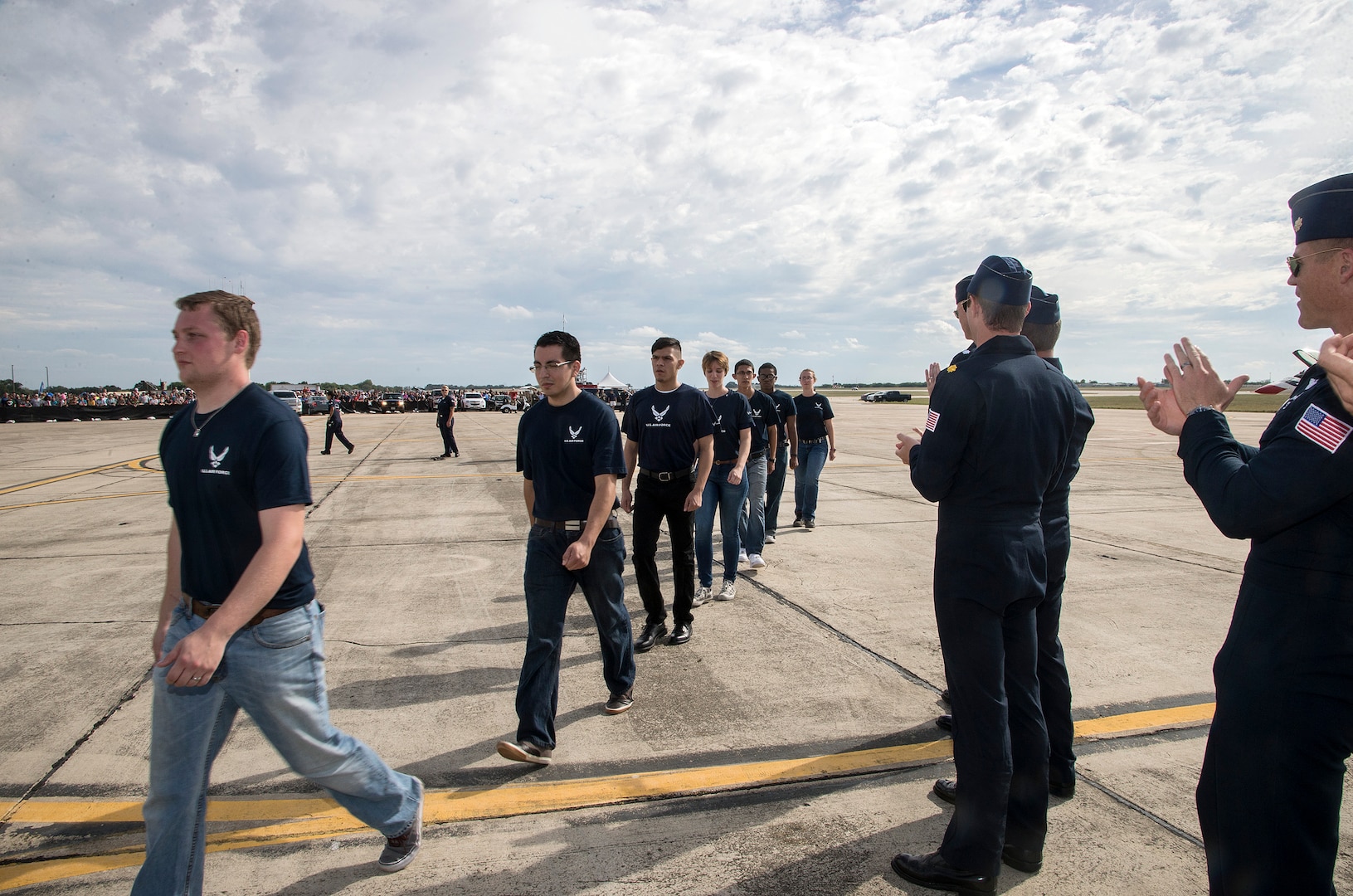 U.S. Air Force Aerial Demonstration Squadron “Thunderbirds” officers congratulate new Air Force recruits at Joint Base San Antonio-Randolph Oct. 31, 2015. The new AF recruits performed an oath of enlistment before the U.S. Thunderbirds performance at the 2015 JBSA Air Show & Open House at JBSA-Randolph. In attendance were friends and family who witnessed the enlistment. (U.S. Air Force photo by photo by Johnny Saldivar)