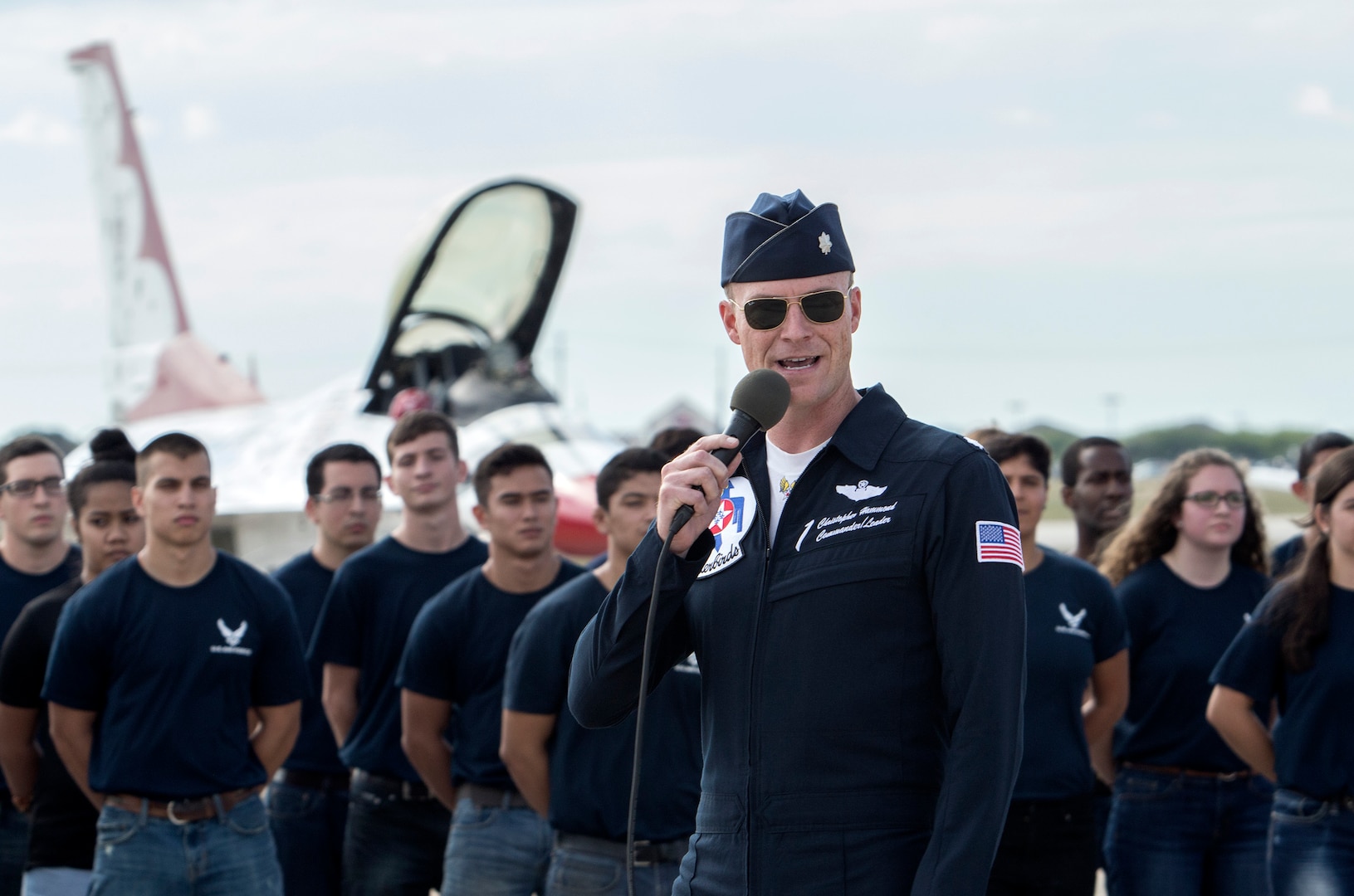 Lt. Col. Christopher Hammond, commander/leader of the U.S. Air Force Air Demonstration Squadron, adresses the crowd before administering the oath of enlistment to new Air Force recruits at Joint Base San Antonio-Randolph Oct. 31, 2015. The enlistment was before the U.S. Thunderbirds performance at the 2015 JBSA Air Show & Open House at JBSA-Randolph. In attendance were friends and family who witnessed the enlistment.(U.S. Air Force photo by photo by Johnny Saldivar)