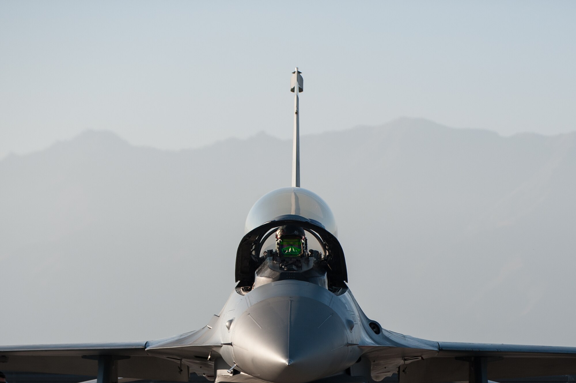 Capt. Tyler McBride, 421st Expeditionary Fighter Squadron chief of safety, deployed from Hill Air Force Base, Utah, lowers the canopy on an F-16 Fighting Falcon before his first combat sortie at Bagram Airfield, Afghanistan, Oct. 30, 2015. The 421st EFS, known as the “Black Widows,” from Hill Air Force Base, Utah, arrived here Oct. 28, 2015 in support of Operation Freedom’s Sentinel and NATO’s Resolute Support mission. (U.S. Air Force photo by Tech. Sgt. Joseph Swafford/Released)