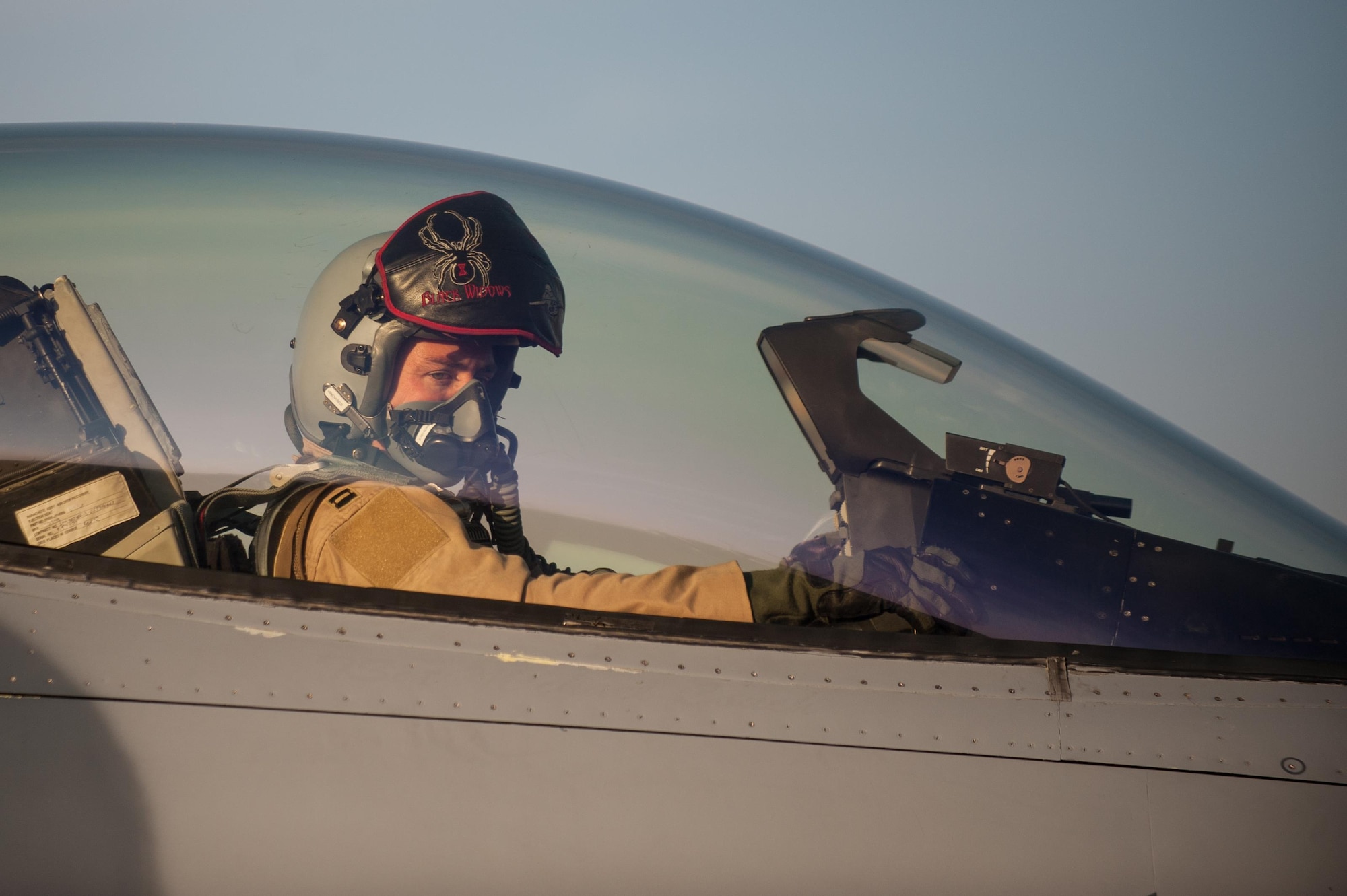 Capt. Tyler McBride, 421st Expeditionary Fighter Squadron chief of safety, deployed from Hill Air Force Base, Utah, prepares for his first combat sortie in an F-16 Fighting Falcon at Bagram Airfield, Afghanistan, Oct. 30, 2015. The 555th EFS, deployed from Aviano Air Base, Italy, is nearing the end of its six-month deployment at Bagram and will hand the reins over to the 421st EFS in support of Operation Freedom's Sentinel and NATO's Resolute Support mission. (U.S. Air Force photo by Tech. Sgt. Joseph Swafford/Released)