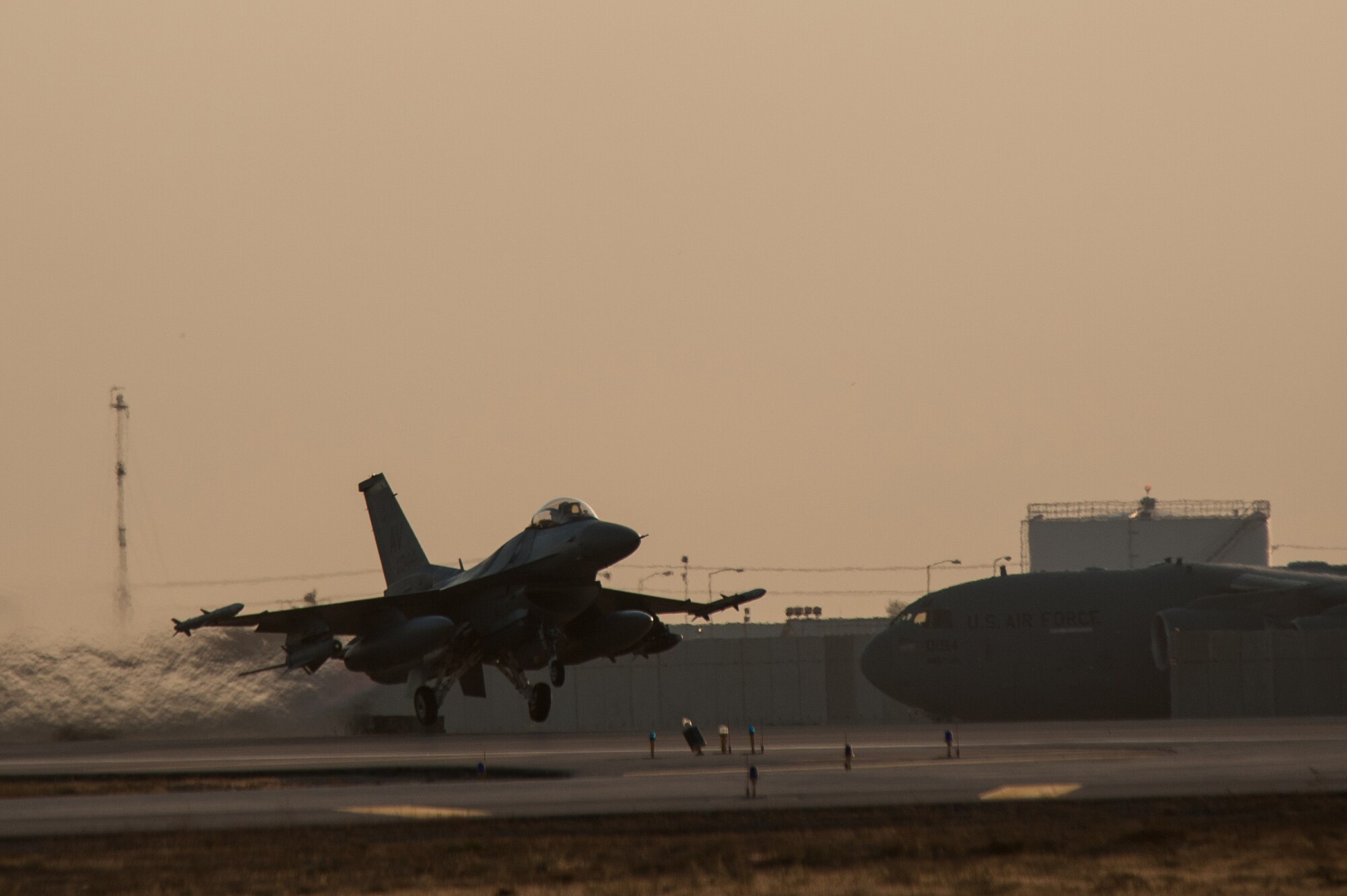Capt. Tyler McBride, 421st Expeditionary Fighter Squadron chief of safety, deployed from Hill Air Force Base, Utah, takes off in an F-16 Fighting Falcon on his first combat sortie from Bagram Airfield, Afghanistan, Oct. 30, 2015. The 555th EFS, deployed from Aviano Air Base, Italy, is nearing the end of its six-month deployment at Bagram and will hand the reins over to the 421st EFS in support of Operation Freedom's Sentinel and NATO's Resolute Support mission. (U.S. Air Force photo by Tech. Sgt. Joseph Swafford/Released)