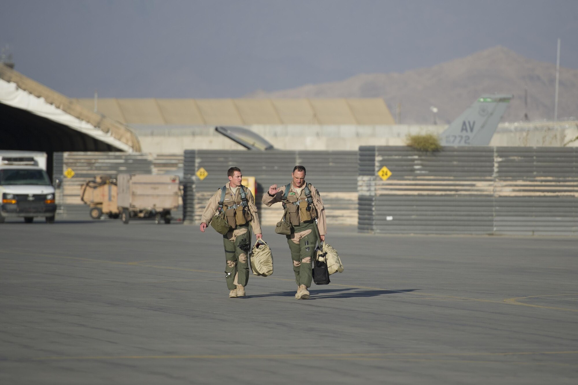 Capt. Tyler McBride (left). 421st Expeditionary Fighter Squadron chief of safety, and Lt. Col. Michael Meyer, 421st EFS commander, step to their F-16 Fighting Falcons at Bagram Airfield, Afghanistan, Oct. 30, 2015. Airmen assigned to the 421st FS, known as the “Black Widows,” from Hill Air Force Base, Utah, arrived here Oct. 28, 2015 in support of Operation Freedom’s Sentinel and NATO’s Resolute Support mission. (U.S. Air Force photo/Tech. Sgt. Robert Cloys/RELEASED)
