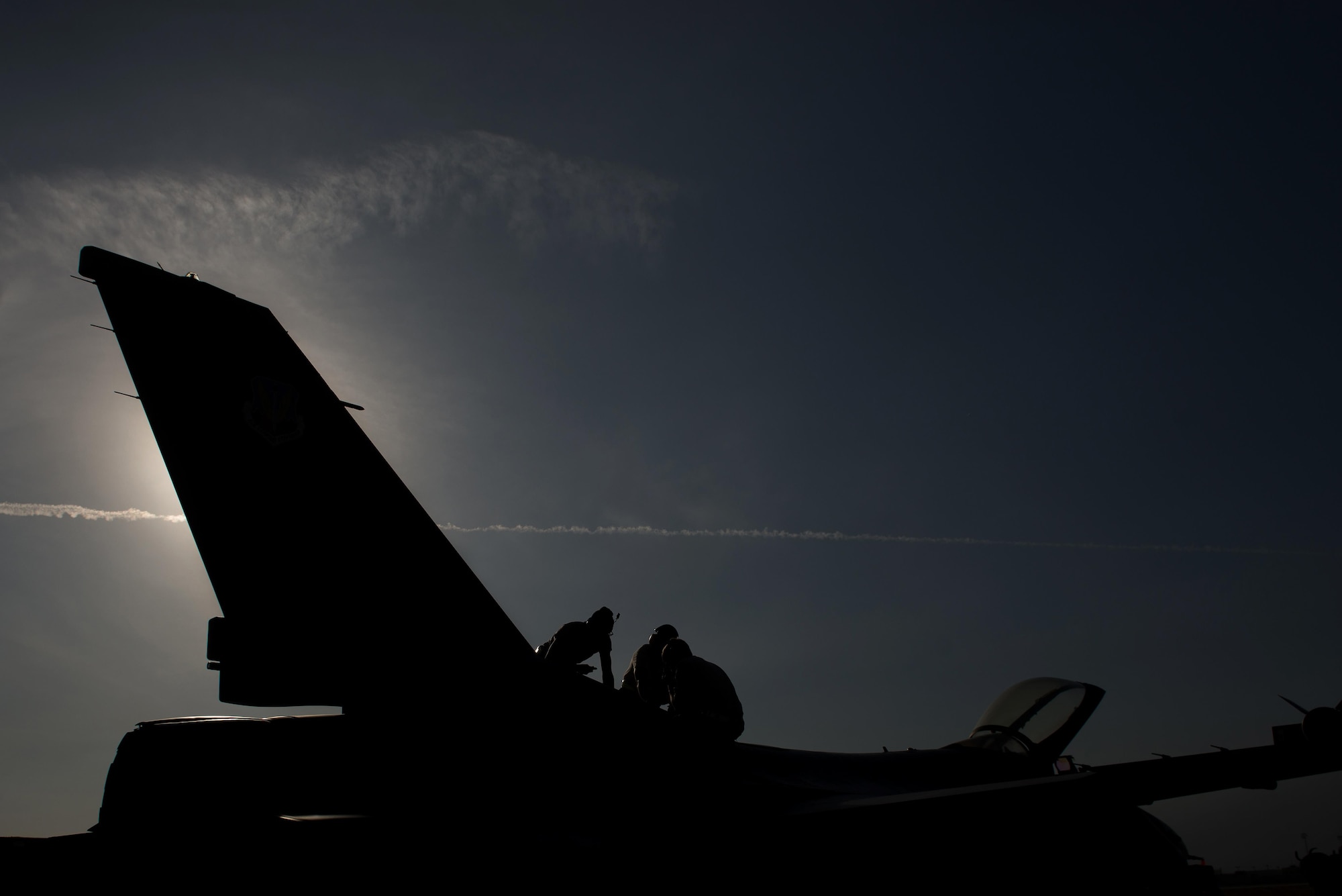 Airmen assigned to the 455th Expeditionary Aircraft Maintenance Squadron, deployed from Hill Air Force Base, Utah, perform maintenance on an F-16 Fighting Falcon at Bagram Airfield, Afghanistan, Oct. 30, 2015. The 455th EAMXS ensure Fighting Falcons on Bagram are prepared for flight and return them to a mission-ready state once they land. (U.S. Air Force photo by Tech. Sgt. Joseph Swafford/Released)