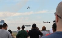 The Tora Tora Tora demonstration group performs a reenactment of the Japanese attack on Pearl Harbor Dec. 7, 1941, while a crowd watches during the 2015 Joint Base San Antonio Air Show and Open House Oct. 31 at JBSA-Randolph. The air show included static displays of not only WWII aircraft, but also planes from the Korean War and the Vietnam War as well as modern aircraft. (U.S. Air Force photo by Senior Airman Krystal Wright)