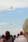 A crowd of visitors to Joint Base San Antonio-Randolph watches the Tora Tora Tora react the Dec. 7, 1941, attack on Pearl Harbor the 2015 JBSA Air Show and Open House Oct. 31. Air shows allow the Air Force to display the capabilities of our aircraft to the American taxpayer through aerial demonstrations and static displays. (U.S. Air Force photo by Senior Airman Krystal Wright)