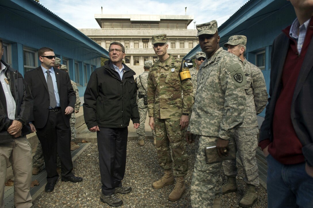 U.S. Defense Secretary Ash Carter speaks with U.S. Army Col. James Minnich, Secretary of the United Nations Command Military Armistice Commission, as he visits the Demilitarized Zone in the Republic of Korea, Nov. 1, 2015. Carter is visiting the Asia-Pacific region, where he will meet with leaders from more than a dozen nations to help advance the next phase of the U.S. military’s rebalance in the region by modernizing longtime alliances and building new partnerships. Photo by Air Force Senior Master Sgt. Adrian Cadiz
