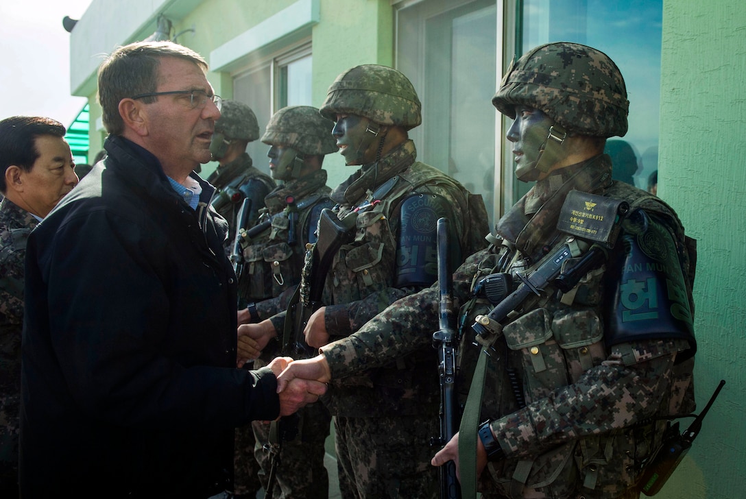 U.S. Defense Secretary Ash Carter shakes hands with Republic of Korea soldiers during a visit to the Demilitarized Zone, in the Republic of Korea, Nov.1, 2015. Carter is visiting the Asia-Pacific region, where he will meet with leaders from more than a dozen nations to help advance the next phase of the U.S. military’s rebalance in the region by modernizing longtime alliances and building new partnerships. Photo by Air Force Senior Master Sgt. Adrian Cadiz