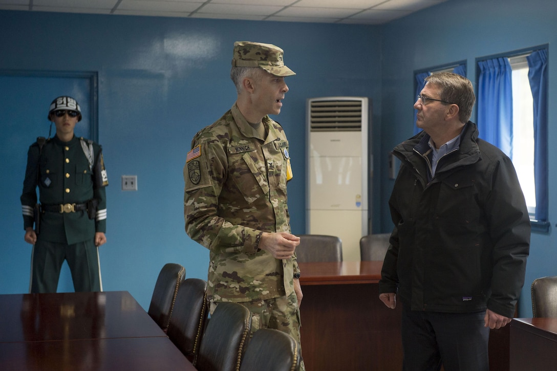 U.S. Defense Secretary Ash Carter speaks with U.S. Army Col. James Minnich, secretary of the United Nations Command Military Armistice Commission, during his visit to the Demilitarized Zone in the Republic of Korea, Nov. 1, 2015. Carter is visiting the Asia-Pacific region, where he will meet with leaders from more than a dozen nations to help advance the next phase of the U.S. military’s rebalance in the region by modernizing longtime alliances and building new partnerships. Photo by Air Force Senior Master Sgt. Adrian Cadiz