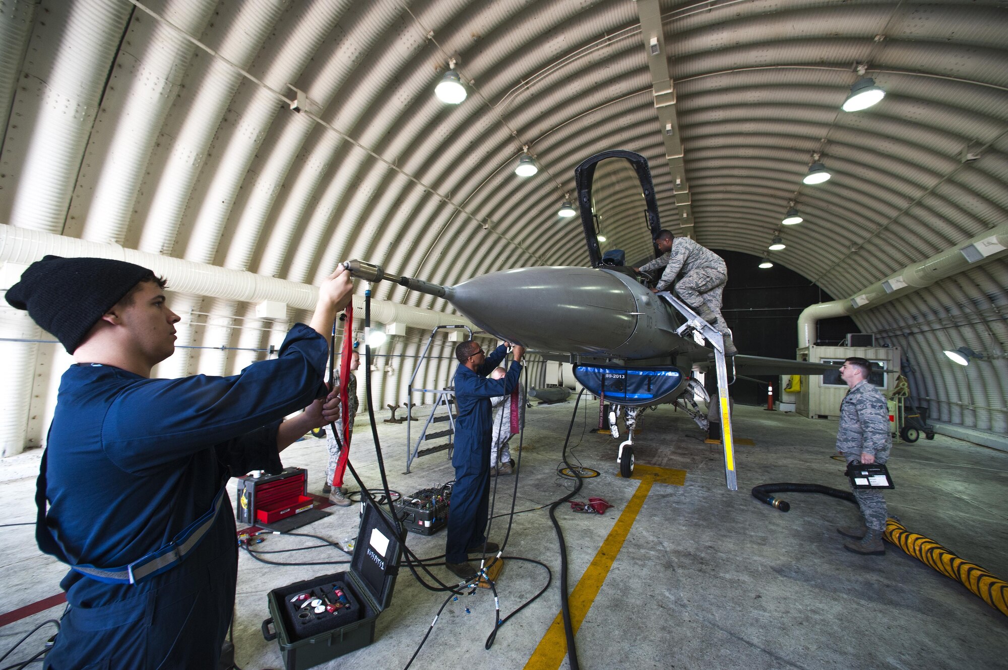 Senior Airman Jacob Clark, 8th Maintenance Squadron aircraft fuels systems journeyman, inspects an F-16 Fighting Falcon at Kunsan Air Base, Republic of Korea, Oct. 29, 2015. The fuels section is responsible for inspecting and repairing aircraft fuel systems, in-flight refueling receptacle systems, and other related components across F-16 aircraft. (U.S. Air Force photo by Staff Sgt. Nick Wilson/Released)