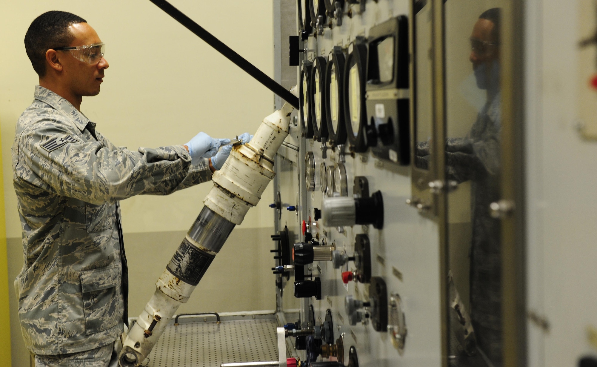 Staff Sgt. Aljhaun Bordenave, 8th Maintenance Squadron hydraulics section chief, performs maintenance on an F-16 Fighting Falcon landing gear component at Kunsan Air Base, Republic of Korea, Oct. 29, 2015. The technicians refurbish approximately 50 brakes each year at $84K per assembly. (U.S. Air Force photo by Staff Sgt. Nick Wilson/Released)