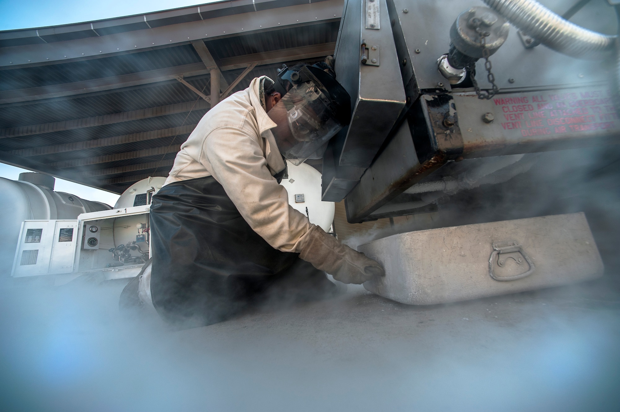Senior Airman Jennifer Cook, 8th Maintenance Squadron aircraft electrical and environmental journeyman, drains a liquid oxygen cart at Kunsan Air Base, Republic of Korea, Oct. 29, 2015. The electrical and environmental section consists of 15 Airmen who are responsible for the repair and maintenance of 39 aircraft parts valued at $256K, including aircraft batteries and liquid oxygen converters. (U.S. Air Force photo by Staff Sgt. Nick Wilson/Released)