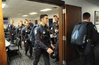 Members of the U.S. Air Force Wings of Blue walk the their aircraft for a performance during the 2015 Joint Base San Antonio Air Show and Open House during the 2015 Joint Base San Antonio Air Show and Open House Nov. 1, 2015 at Joint Base San Antonio-Randolph, Texas. Air shows allow the Air Force to display the capabilities of our aircraft to the American taxpayer through aerial demonstrations and static displays and allowing attendees to get up close and personal to see some of the equipment and aircraft used by the U.S. military today. (U.S. Air Force photo by Melissa Peterson) 