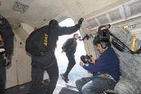 Members of the U.S. Army Golden Knights jumps out an aircraft during the 2015 Joint Base San Antonio Air Show and Open House Nov. 1, 2015 at JBSA-Randolph. The United States Army Parachute Team, nicknamed and commonly known as the Golden Knights, is a demonstration and competition parachute team of the United States Army.The demonstration teams, which use five dedicated aircraft, perform at more than 100 events per year. (U.S. Air Force photo by Joel Martinez/Released)