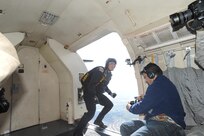 A member of the U.S. Army Golden Knights prepares to jump out aircraft during the Joint Base San Antonio 2015 Air Show and Open House Nov. 1, 2015 at JBSA-Randolph. The United States Army Parachute Team, nicknamed and commonly known as the Golden Knights, is a demonstration and competition parachute team of the United States Army.The demonstration teams, which use five dedicated aircraft, perform at more than 100 events per year. (U.S. Air Force photo by Joel Martinez/Released)