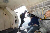 A member of the U.S. Army Golden Knights prepares to jump out of an aircraft during the 2015 Joint Base San Antonio Air Show and Open House Nov. 1, 2015 at JBSA-Randolph. The United States Army Parachute Team, nicknamed and commonly known as the Golden Knights, is a demonstration and competition parachute team of the United States Army.The demonstration teams, which use five dedicated aircraft, perform at more than 100 events per year. (U.S. Air Force photo by Joel Martinez/Released)