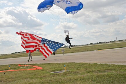 A member of the U.S. Air Force Wings of Blue prepares to land during the 2015 Joint Base San Antonio Air Show and Open House Nov. 1, 2015 at JBSA-Randolph, Texas. Air shows allow the Air Force to display the capabilities of our aircraft to the American taxpayer through aerial demonstrations and static displays and allowing attendees to get up close and personal to see some of the equipment and aircraft used by the U.S. military today. (U.S. Air Force photo by Olivia Mendoza) 