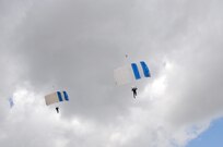 The U.S. Air Force Wings of Blue perform during the 2015 Joint Base San Antonio Air Show and Open House Nov. 1, 2015 at JBSA-Randolph, Texas. Air shows allow the Air Force to display the capabilities of our aircraft to the American taxpayer through aerial demonstrations and static displays and allowing attendees to get up close and personal to see some of the equipment and aircraft used by the U.S. military today. (U.S. Air Force photo by Olivia Mendoza) 