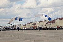 The U.S. Air Force Wings of Blue parachute team lands during the 2015 Joint Base San Antonio Air Show and Open House Nov. 1, 2015 at JBSA-Randolph, Texas. Air shows allow the Air Force to display the capabilities of our aircraft to the American taxpayer through aerial demonstrations and static displays and allowing attendees to get up close and personal to see some of the equipment and aircraft used by the U.S. military today. (U.S. Air Force photo by Olivia Mendoza) 