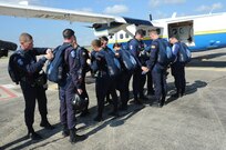 Members of the U.S. Air Force Wings of Blue inspect each others equipment prior to take-off during the 2015 Joint Base San Antonio Air Show and Open House Nov. 1, 2015 at Joint Base San Antonio-Randolph, Texas. Air shows allow the Air Force to display the capabilities of our aircraft to the American taxpayer through aerial demonstrations and static displays and allowing attendees to get up close and personal to see some of the equipment and aircraft used by the U.S. military today. (U.S. Air Force photo by Melissa Peterson) 