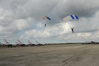 Members of the U.S. Air Force Wings of Blue prepare to land during the 2015 Joint Base San Antonio Air Show and Open House Nov. 1, 2015 at Joint Base San Antonio-Randolph, Texas. Air shows allow the Air Force to display the capabilities of our aircraft to the American taxpayer through aerial demonstrations and static displays and allowing attendees to get up close and personal to see some of the equipment and aircraft used by the U.S. military today. (U.S. Air Force photo by Melissa Peterson) 