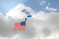 A member of the U.S. Air Force Wings of Blue parachute team performs during the 2015 Joint Base San Antonio Air Show and Open House Nov. 1, 2015 at JBSA-Randolph, Texas. Air shows allow the Air Force to display the capabilities of our aircraft to the American taxpayer through aerial demonstrations and static displays and allowing attendees to get up close and personal to see some of the equipment and aircraft used by the U.S. military today. (U.S. Air Force photo by Melissa Peterson) 