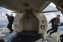 Specialist Alex Bahry and Staff Sgt. Brandan Parra, U.S. Army Parachute Team “Golden Knights” demonstration parachutists,  jump out of a C-31 A Troopship during the Joint Base San Antonio Air Show and Open House Nov. 1, 2015, at JBSA-Randolph. Air shows allow the Air Force and sister services to display the capabilities of military aircraft and members to the American taxpayer through aerial demonstrations and static displays.