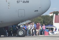 Residents of San Antonio line up to board a C-17 Globemaster III static display at the 2015 Joint Base San Antonio Air Show and Open House Nov. 1, 2015 at JBSA-Randolph, Texas.  Air shows allow the Air Force to display the capabilities of our aircraft to the American taxpayer through aerial demonstrations and static displays. JBSA-Randolph’s air show allowed attendees to get up close and personal to see some of the equipment and aircraft used by the U.S. military today. (U.S. Air Force photo by Senior Airman Krystal Wright/Released)