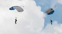 Members of the U.S. Air Force Wings of Blue perform during the 2015 Joint Base San Antonio Air Show and Open House Nov. 1, 2015, at JBSA-Randolph, Texas.  Air shows allow the Air Force to display the capabilities of our aircraft to the American taxpayer through aerial demonstrations and static displays. JBSA-Randolph’s air show allowed attendees to get up close and personal to see some of the equipment and aircraft used by the U.S. military today.  (U.S. Air Force photo by Senior Airman Krystal Wright/Released)