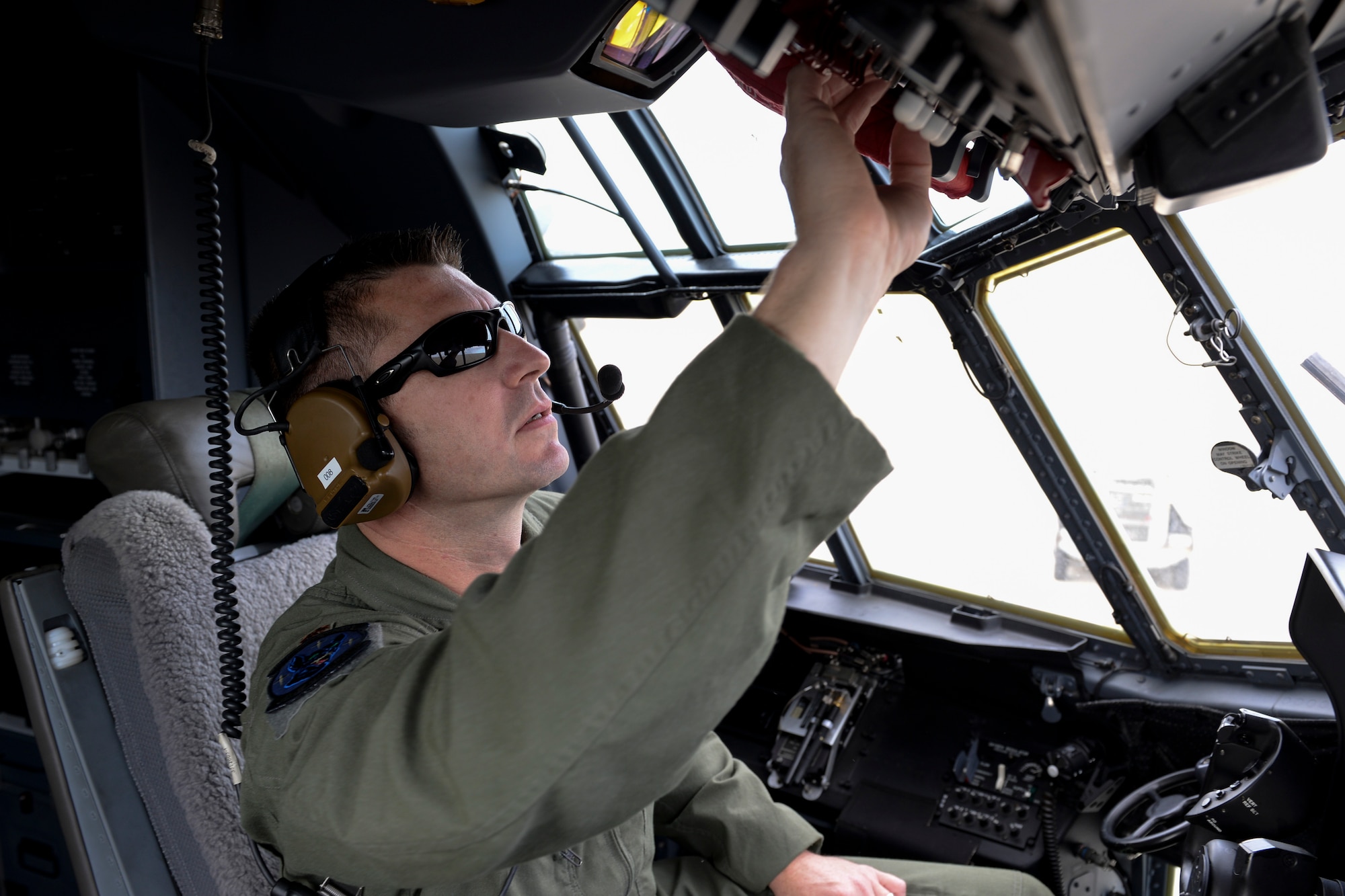 U.S. Air Force Maj. Robert Bingham, 17th Special Operations Squadron Standards and Evaluation chief, completes preflight checklist before flying the MC-130J Commando II Sept. 10, 2015, on Kadena Air Base, Japan. Bingham received the General P.K. Carlton Award from the Airlift/Tanker Association during an award banquet held Oct. 29 in Orlando, Fla. (U.S. Air Force photo by Senior Airman John Linzmeier)