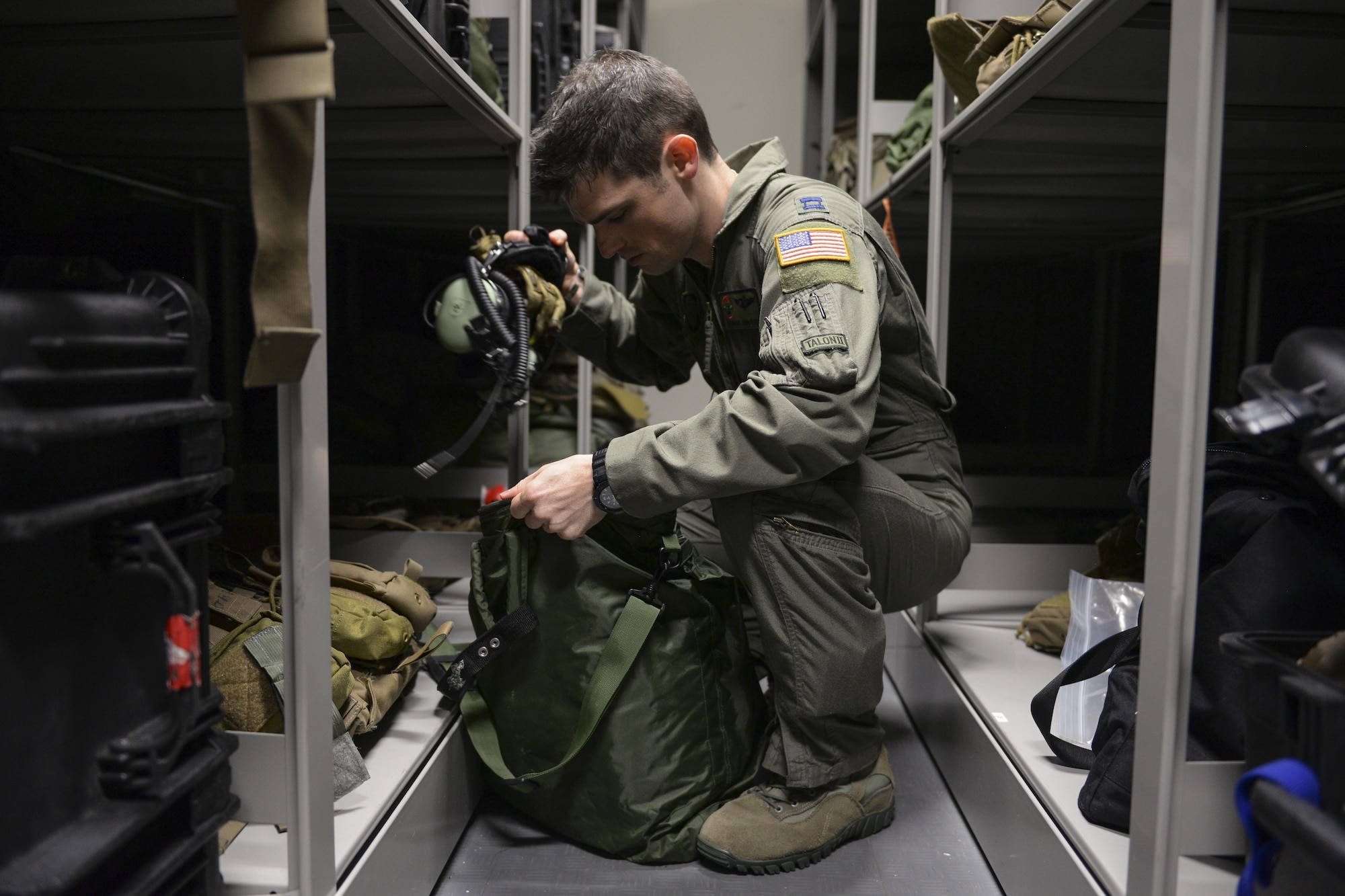U.S. Air Force Capt. Thomas Sanders, 353rd Special Operations Support Squadron instructor navigator, acquires a headset from a storage unit prior to a training mission Sept. 10, 2015 at Kadena Air Base, Japan. Sanders received the Airlift/Tanker Association Young Leadership Award during an award banquet held Oct. 29 in Orlando, Fla. (U.S. Air Force photo by Airman 1st Class Corey M. Pettis) 
