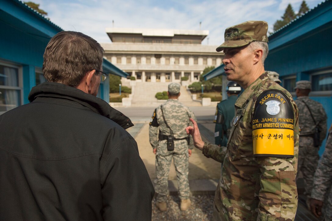 Secretary of Defense Ash Carter speaks with U.S. Army  Col. James Minnich, Secretary of the United Nations Command Military Armistice Commission, as he visits The Demilitarized Zone in the Republic of Korea Nov. 1, 2015,  as part of his Asia-Pacific trip. During the trip the secretary will meet with leaders from more than a dozen nations across East Asia and South Asia to help advance the next phase of the U.S. military’s rebalance in the region.  Photo by Senior Master Sgt. Adrian Cadiz