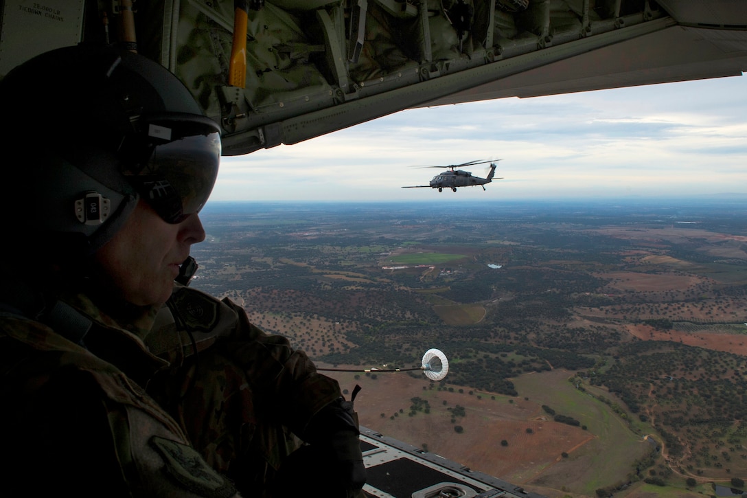 U.S. Air Force Col. Thomas Dorl looks out the back of a C-130J Hercules aircraft during the rescue and refueling training part of Trident Juncture near Beja Air Base, Portugal, Oct. 23, 2015. Dorl is commander, 347th Rescue Group. U.S. Air Force photo by Airman 1st Class Luke Kitterman