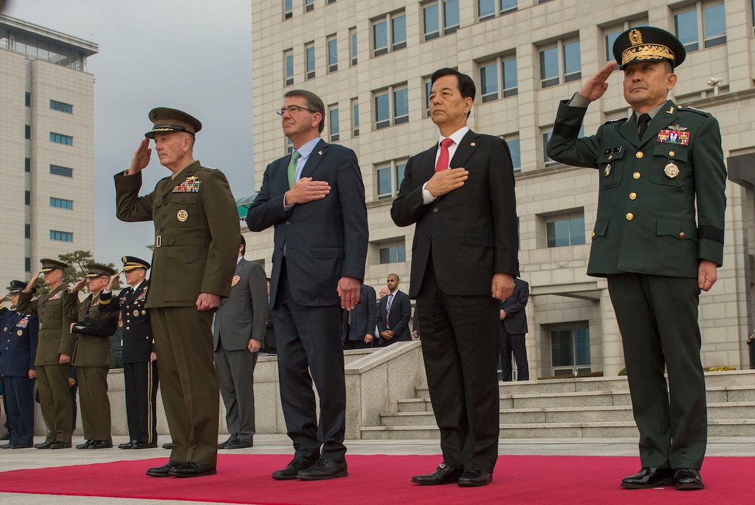 From left, U.S. Marine Corps Gen. Joseph F. Dunford Jr., chairman of the Joint Chiefs of Staff, U.S. Defense Secretary Ash Carter; South Korean Defense Minister Han Min-koo; and South Korean Army Gen. Lee Sun-jin, Dunford’s South Korean counterpart, render honors as the U.S. and South Korean national anthems are played during an honor guard ceremony before the start of the 47th U.S.-South Korea Security Consultative Meeting in Seoul, South Korea, Nov. 2, 2015. DoD photo by Air Force Senior Master Sgt. Adrian Cadiz