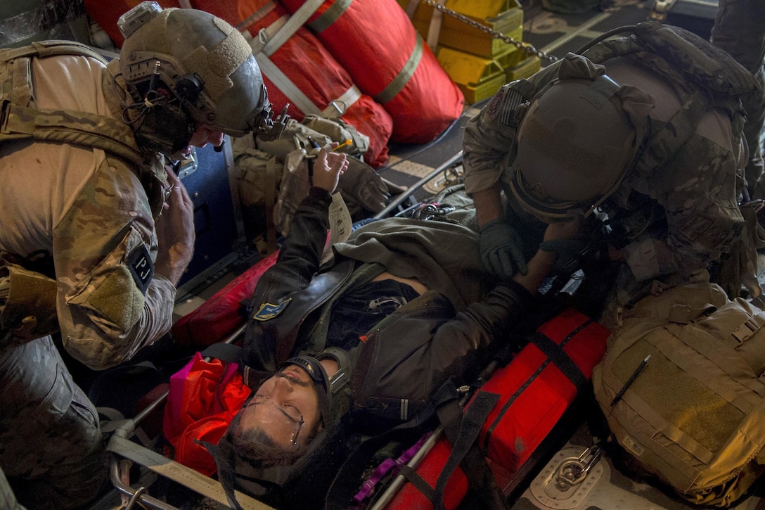 U.S. airmen practice medical treatment on a Portuguese air force pilot during Trident Juncture 2015 near Beja Air Base, Portugal, Oct. 23, 2015. U.S. Air Force photo by Airman 1st Class Luke Kitterman