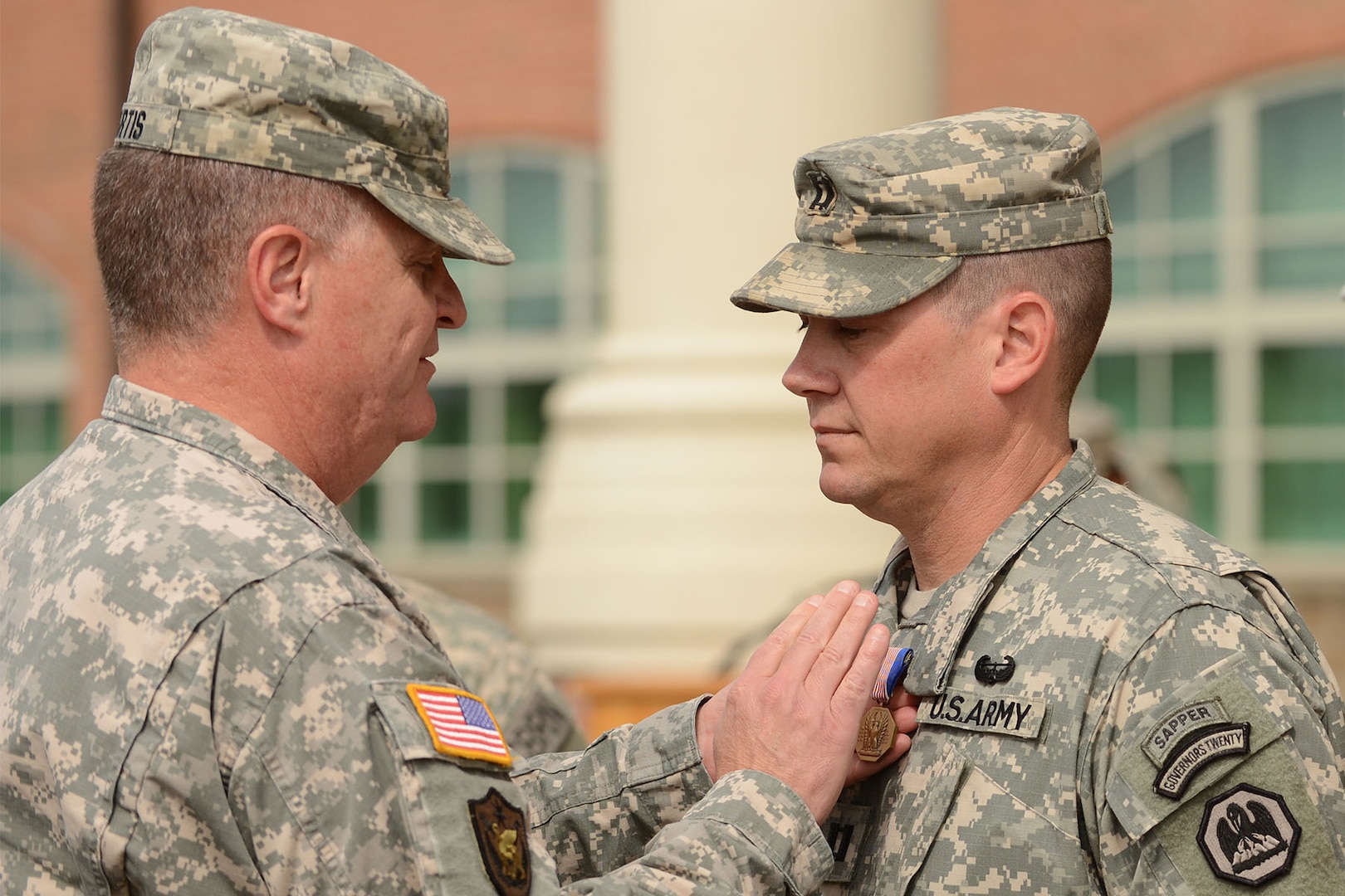 Louisiana National Guard Capt. Andrew Gremillion receives the Soldier's Medal from Maj. Gen. Glenn H. Curtis, adjutant general of the Louisiana National Guard, during a ceremony in Baton Rouge, Louisiana., Oct. 30, 2015. Gremillion was recognized with the highest award for non-combat valor for risking his life to save a woman trapped in a sinking car.